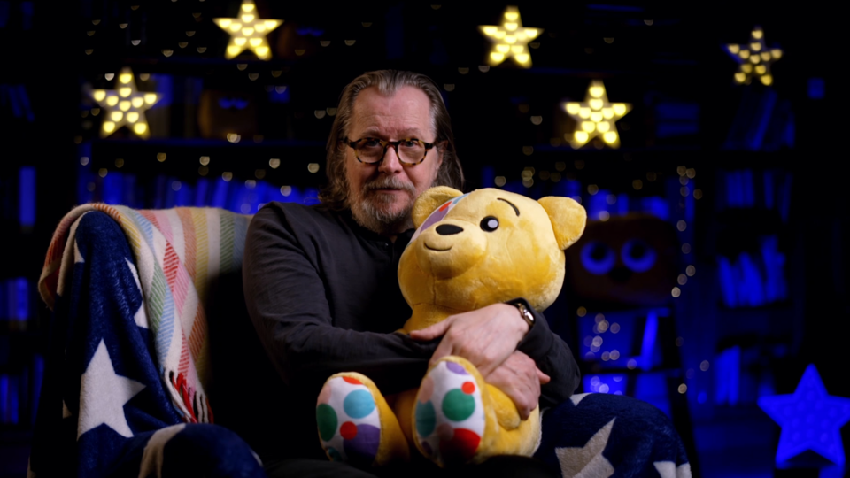 Gary Oldman holding Pudsey Bear