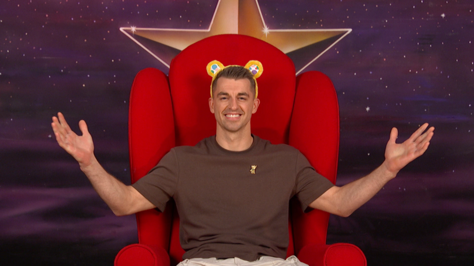 Max Whitlock sitting in a large red chair