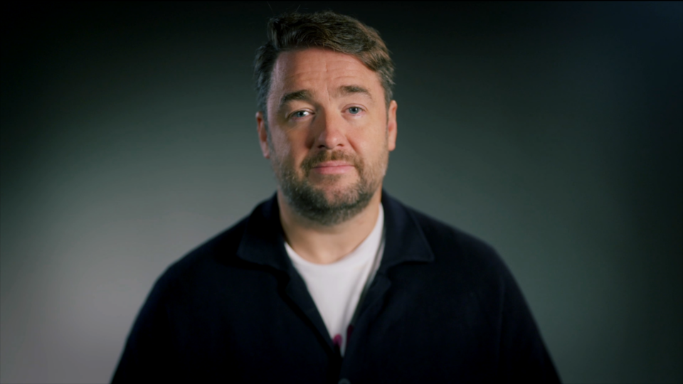 Jason Manford against a dark grey background