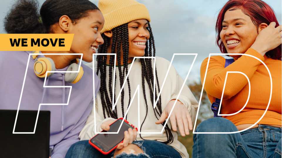 Young people smiling and chatting with a phone and headphones