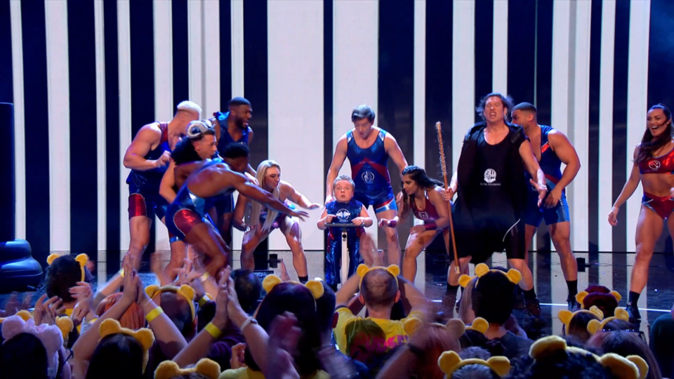 Gladiators surround the presenters of Children in Need who are also dressed as Gladiators